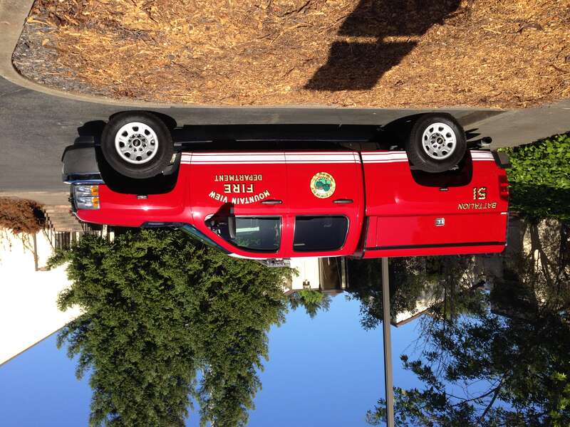 A pickup truck owned by the city of Mountain View, California, in red and gold livery.
