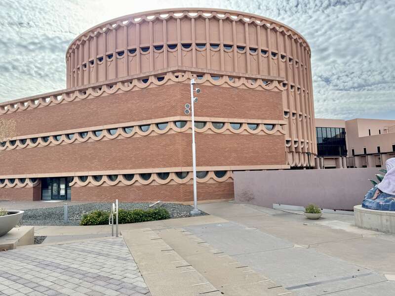 Built in 1970, this Modern Usonian building was designed by Wesley Peters of Taliesin Associated Architects for Arizona State University to house the School of Music, Dance and Theatre.  The building consists of a taller cylindrical section clad in