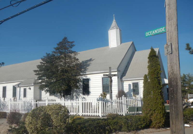 Looking north across Oceanside Avenue at church on a sunny midday.