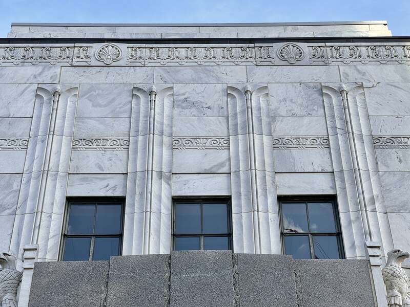 Built in 1932-1934, this Art Deco-style building was designed by Marr and Holman to serve as a United States Post Office for the city of Nashville.  The building is clad in marble with a gray granite base, metal-frame windows, metal spandrels,