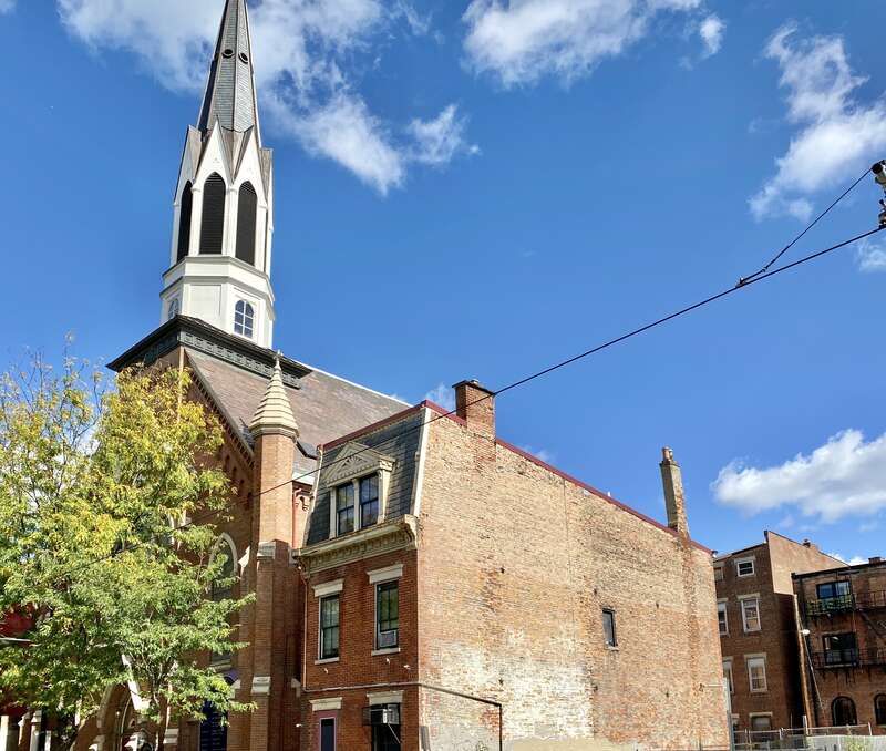 Built in 1871, this Gothic Revival-style church was built to house the congregation of what was then known as Trinity Lutheran Church, later known as Concordia Lutheran Church, and now known as Prince of Peace Lutheran Church, and stands on Race