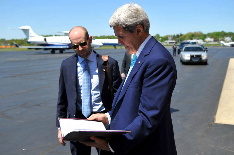 U.S. Secretary of State John Kerry and Speechwriter Stephen Krupin reviews the remarks the Secretary will deliver at Yale University's Class Day ceremonies in New Haven, Connecticut, on May 18, 2014. [State Department photo/ Public Domain]