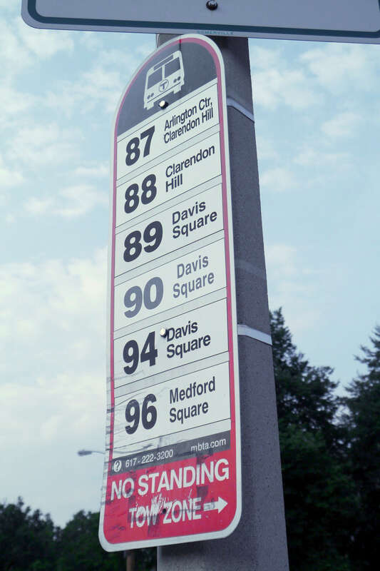 Bus stop sign for the 87, 88, 89, 90, 94, and 96 buses at the Grove Street stop (the entrance to the Davis station busway)