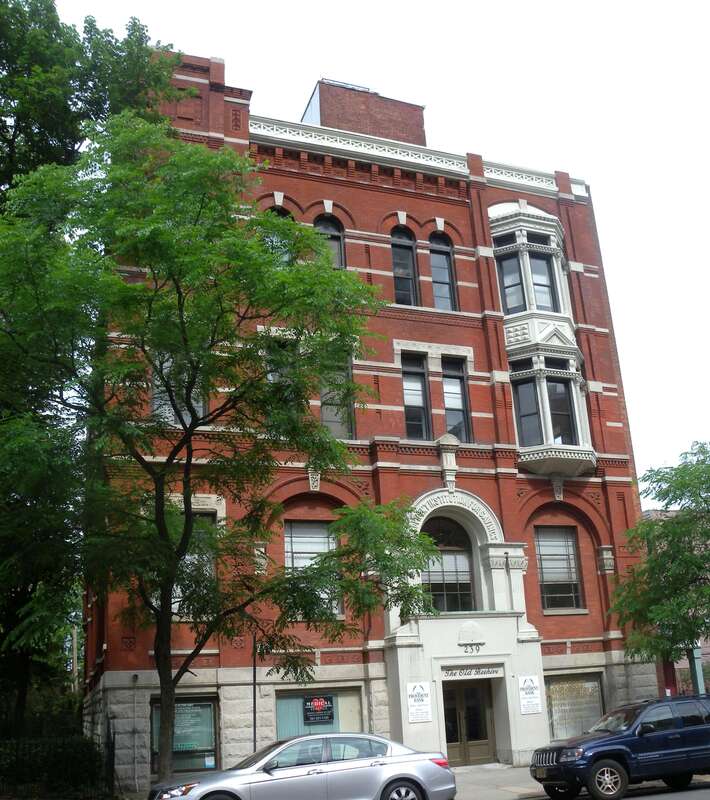 Looking west across Washington Street at Provident Savings Bank building on a cloudy morning.