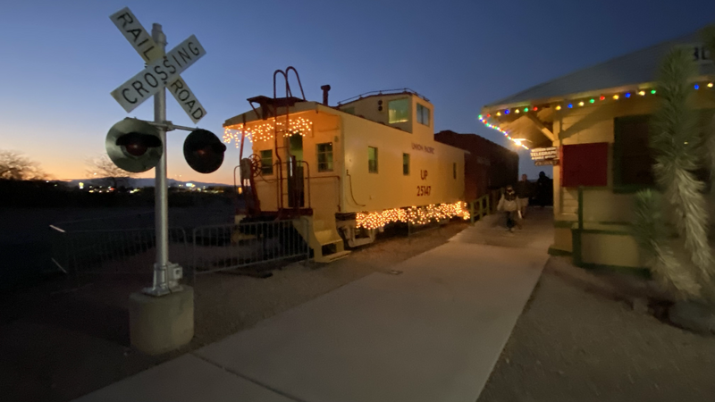 Union Pacific caboose on static display at the Clark County Museum in Henderson, Nevada positioned right behind Union Pacific Railroad No. 4442.