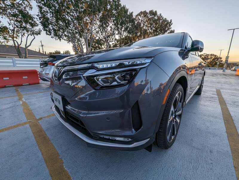 The VF8 is a battery-electric SUV made by Vinfast. This example is gray and was parked at Hillsdale Shopping Center in San Mateo, California.