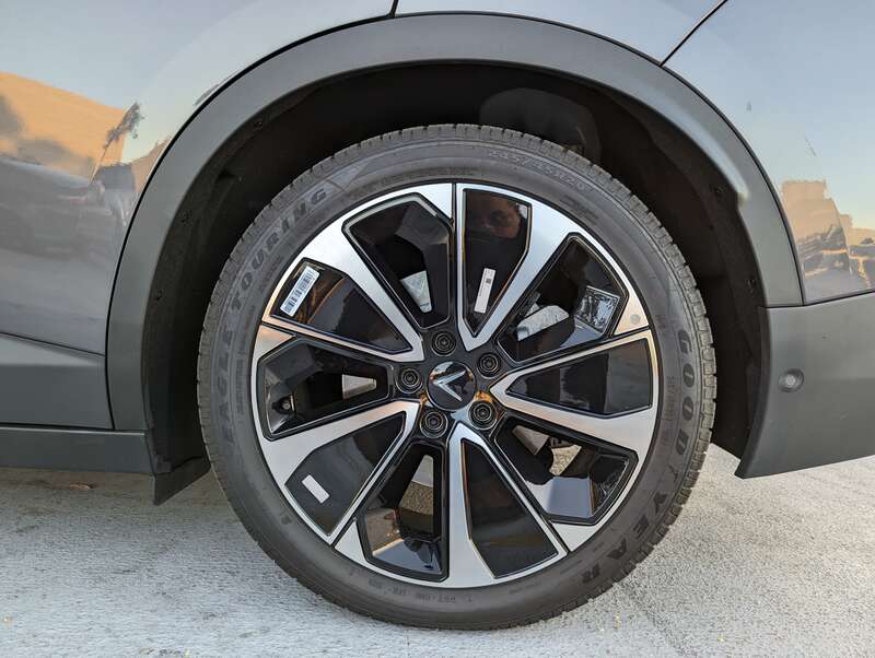 The VF8 is a battery-electric SUV made by Vinfast. This example is gray and was parked at Hillsdale Shopping Center in San Mateo, California.