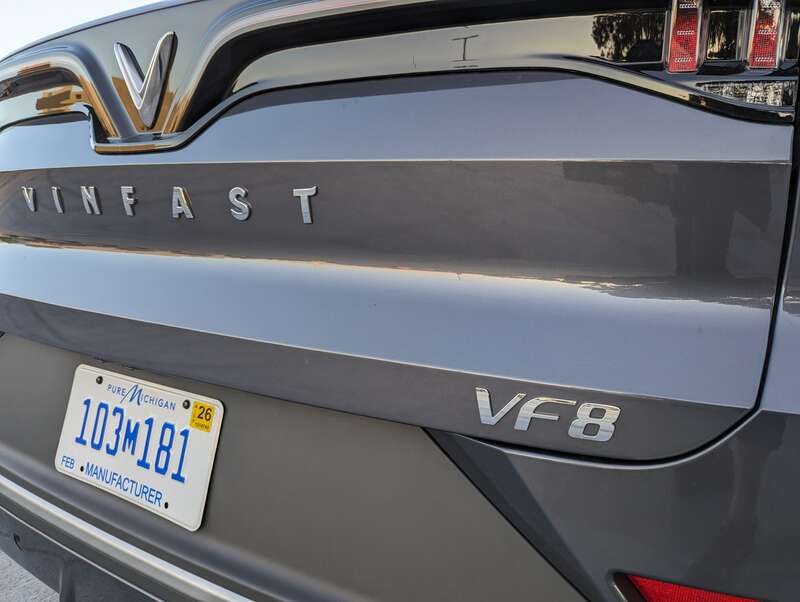 The VF8 is a battery-electric SUV made by Vinfast. This example is gray and was parked at Hillsdale Shopping Center in San Mateo, California.
