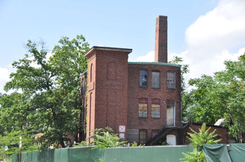 A photograph of the historic O'Hara Waltham Dial Company factory in Waltham, Massachusetts.