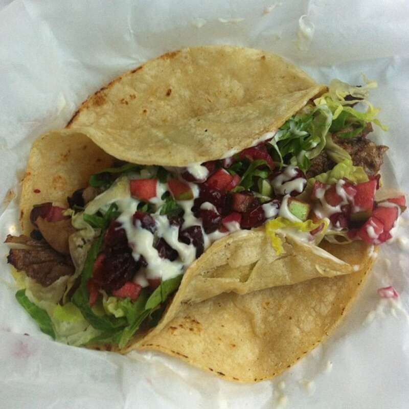 White Duck Taco Shop Asheville -  Molé Duck Taco with crema and cranberry-apple salsa. Wonderful!