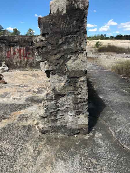Old stone wall of abandoned building at Arabia Mountain Park.