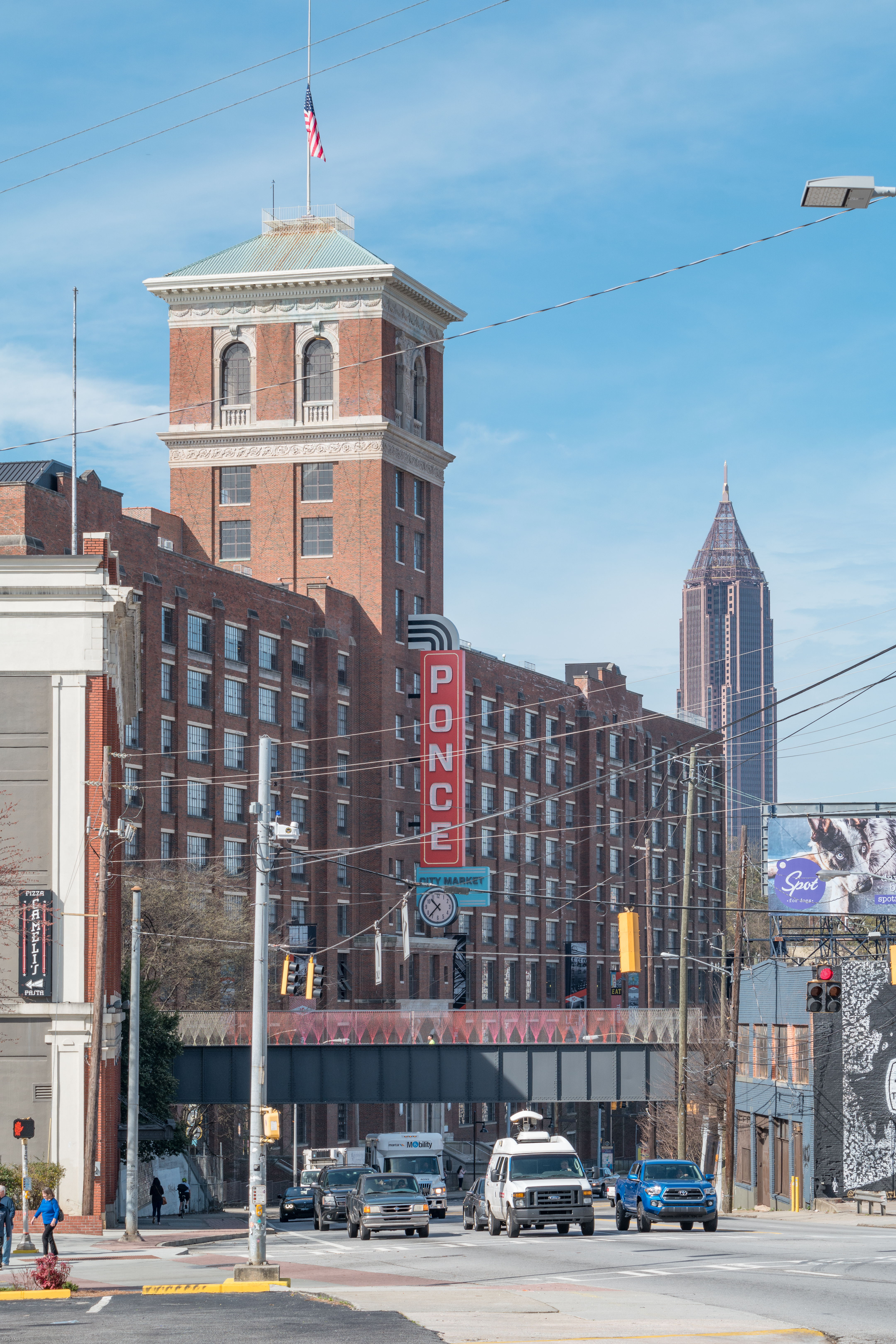 This is a view of Ponce City Market taken from Green's Liquor Store on Ponce de Leon Avenue, Atlanta. In the middleground you can see the bridge of the Eastside BeltLine Trail where it passes over Ponce. In the background on the right stands Bank of
