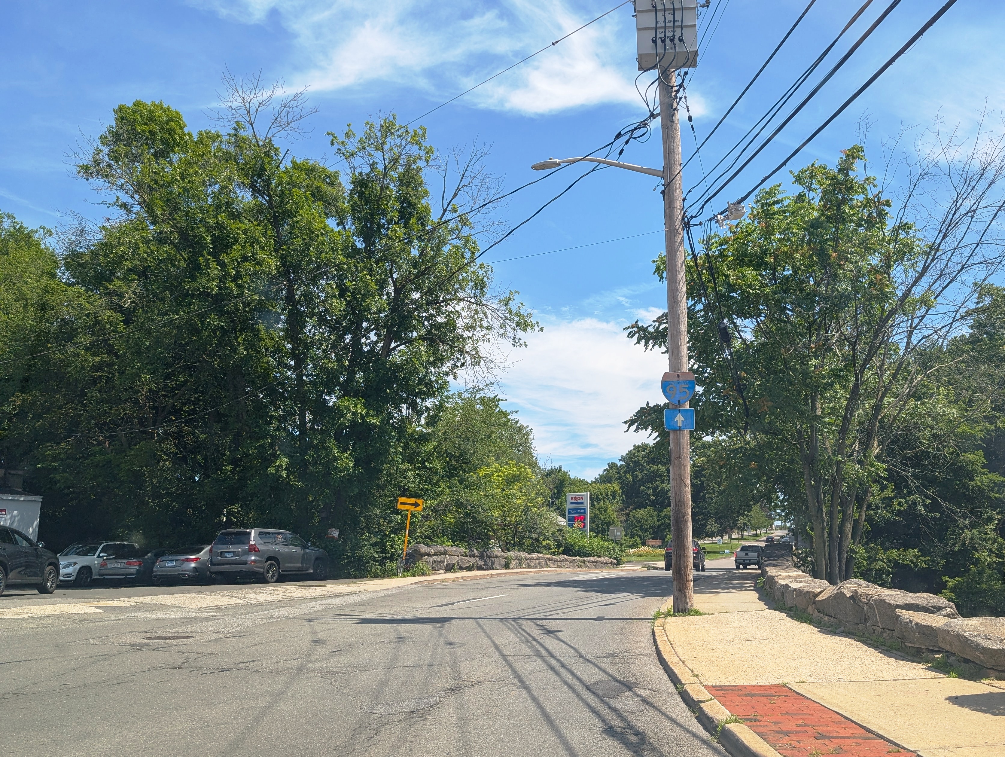 Photo of northbound U.S. Route 1 (North Main Street) in Port Chester, New York approaching a traffic circle straddling the Connecticut state line. Photo taken looking north-northeast at Putnam Avenue.