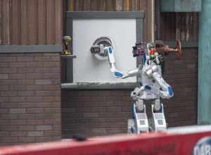 The HUmanoid roBOt, HUBO, from the Korea Advanced Institute of Science and Technology (KAIST), cuts a hole in drywall during the Defense Advanced Research Projects Agency (DARPA) Robotics Challenge (DRC) June 5 in Pomona, California. The DRC is a