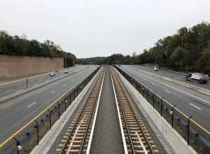 View east along Virginia State Route 267 (Dulles Toll and Access Roads) and the Silver Line of the Washington Metro from the overpass for Virginia State Route 676 (Trap Road) in Wolf Trap, Fairfax County, Virginia