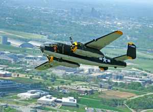 The Champaign Gal B-25 Mitchell bomber performs a flyby over the National Museum of the U.S. Air Force in honor of the 70th reunion of the Doolittle Tokyo Raiders.  (U.S. Air Force photo by Tech. Sgt. Bennie J. Davis III)