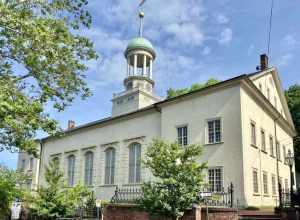 Built between 1803 and 1806, this Classical Revival-style church was built to serve the Moravian community in Bethlehem, which settled in the area during the mid-18th Century.  The building features a simple stucco-clad exterior with six-over-six and