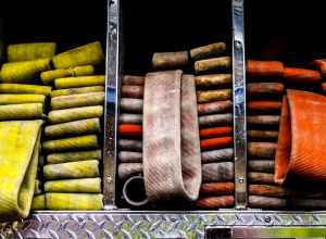 Fire hose on a fire truck in Glendale California. 3 packs of water hose .