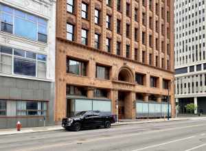 [Built in 1895-1896, this Chicago School-style thirteen-story skyscraper was designed by Louis Sullivan and Dankmar Adler for the Guaranty Construction Company.  It was initially commissioned by Hascal L. Taylor, whom approached Dankmar Adler to