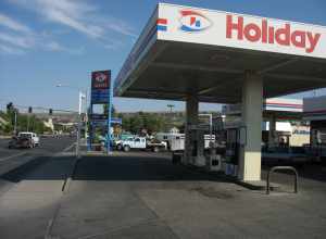 Holiday Stationstore gas station, 2620 6th Ave. N., at N. 27th St. (Montana Highway 3), east corner, Billings, Montana.  Appears to be looking roughly north-northeast, towards just left of Cobb Field (light assembly visible 470 meters (1,540 ft)