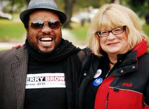 Cindy Harris, Event Coordinator and Volunteer Campaign Coordinator for Jerry Brown, makes nice with Nicholas Hatten at the Jerry Brown rally in Victory Park, Stockton. Three days to go before the election &amp; the push is on...