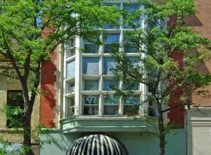 The Lamb Building (1905) at 114 State Street in Madison, Wisconsin, was added to the National Register of Historic Places in 1984.  With its two-story bays, leaded glass detail, and original Carroll Street storefront, this is one of Madison's best