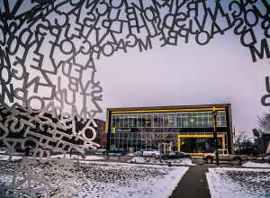 The Microsoft Store and Locust Street as seen from inside Jaume Plensa's "Nomade" at the Pappajohn Sculpture Park in Des Moines, Iowa.