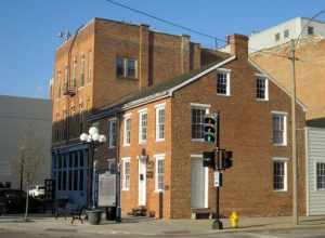 The Miller-Davis Law Buildings in Bloomington (1843). Built by James Miller and David Davis, they were the second and third brick business buildings in Bloomington. Today, they are the oldest buildings in downtown Bloomington and the only