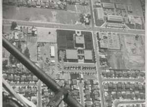 Aerial view of Cypress Civic Center (lower left quadrant) and Oxford Junior High School (upper right), before the construction of the Cypress Library (left of the civic center). The intersection shown is Orange Avenue (W/E) at Grindlay (N/S) This