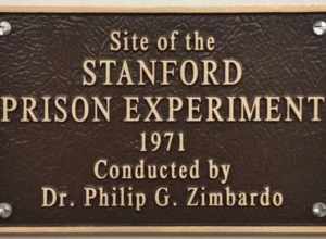 This image shows a plaque marking the site where the famous Stanford Prison Experiment was conducted. The point of this experiment was to study the psychological effects of students becoming either a prisoner or a prison guard. The students easily