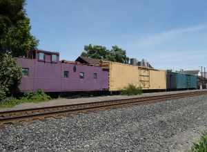 Old railroad cars behind the former Southern Pacific Railroad station in Turlock in May 2022