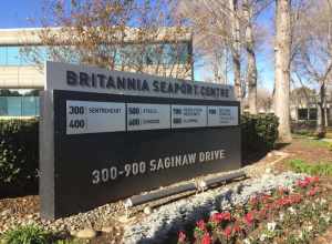Business listing sign at Seaport Centre in Redwood City California listing: SentreHeart, Atreca, Cardiodx, Revolution Medicines, Illumina, and Dextera Surgical.