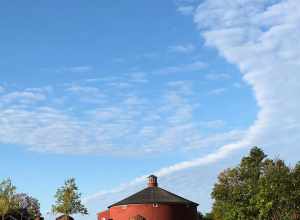 The Round Barn was originally constructed in East Passumpsic, VT in 1901 and was moved to the grounds of Shelburne Museum in 1985-1986. It is one of 39 exhibition buildings at the Museum.