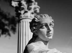 
500px provided description: I took this at Kapok Gardens in Clearwater, FL. Really neat place and good for some black and white shots. [#black and white ,#statue ,#marble ,#Nikon D700]