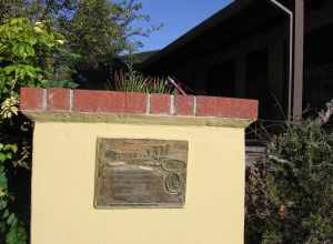 A bronze plaque marking the site of the Vallejo home site along Washington Boulevard (near Mission Boulevard) in the Mission San José district of Fremont, California.  View is looking north from the north sidewalk of Washington Blvd.