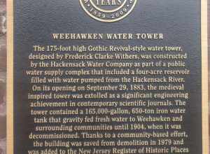 A plaque at the Weehawken Water Tower Park, it reads:
Weehawken Water Tower
The 175-foot high Gothic Revival-style water tower,
designed by Frederick Clarke Withers, was constructed
by the Hackensack Water Company as part of a public
water supply