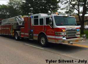 Lenexa, Kansas Fire Department's Ladder 91 a 2012 Pierce Velocity PUC Tiller 100' Ladder Responding (Picture is a screenshot from a Video) Picture ID# 9816