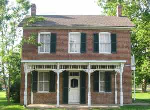 Front of the Paul Dresser Birthplace, located on the northwestern corner of the junction of First and Farrington Streets in Terre Haute, Indiana, United States.  Built in 1850, it is listed on the National Register of Historic Places.