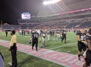 UCF players and staff leaving the field after the loss