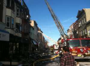 Firefighters from North Hudson Regional Fire and Rescue deal with the aftermath of a fire on Bergenline Avenue between 21st and 22nd Streets in Union City, New Jersey on January 20, 2012. The fire, which started around 9pm on January 18, was not