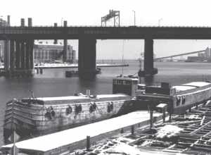 Three barges in the harbor of Bridgeport, Connecticut, in 1973.  All three sank in 1974.  At the rear right is the Elmer S. Dailey, at the front is the Priscilla Dailey, with the Berkshire No. 7 next to it.