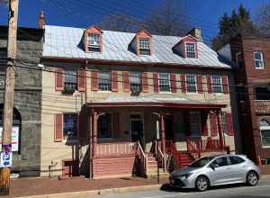 Description from the plaque on the building: "Disney's Tavern Ca 1790 Deborah Disney ran her tavern, a popular gathering place for men, on this site from 1840-1862. The building continued as a tavern throughout the late 19th century. Later a fabric