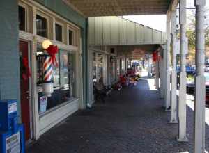 A view of Downtown Northport Alabama, standing in front of the barber shop and looking South toward the river.