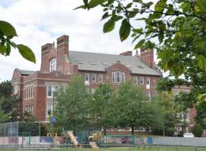 A photograph of the historic Charles A. Daniels School in Malden, Massachusetts.