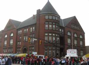 Northern and eastern sides of Memorial Hall, located at 165 E. Main Street in Circleville, Ohio, United States.  Built in 1891, the hall is listed on the National Register of Historic Places.  Photo is taken during the Circleville Pumpkin Show, which