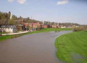 Galena River flowing through downtown Galena, Illinois, USA. The river was abnormally high in this shot. The buildings on the left are members of the Galena Historic District, which is listed on the U.S. National Register of Historic Places.