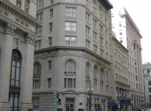 New Orleans: Carondelet Street, with view of the Cotton Exchange building on left just past cross-street (Common).