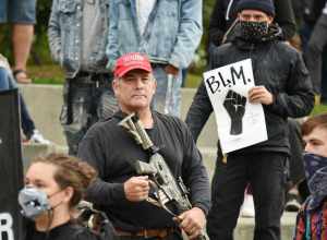 Counter-protester wearing Donald Trump campaign paraphernalia at the March on Alaska.
March on Alaska event in Anchorage, Alaska. Presented by the Alaska Black Caucus. September 7, 2020.

This photo is available for free public use. Please provide