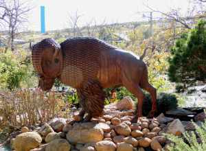 Bison bronze sculpture is located at the entrance of the Medicine Park Music Hall and Event Center. The repoussé and chasing metal sculpture is visual art created and designed by Medicine Park resident and sculptor Robert Errol Dean (b. 1948 - d.