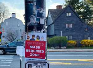 Sign indicating masks required in Salem, Massachusetts during the COVID-19 pandemic.